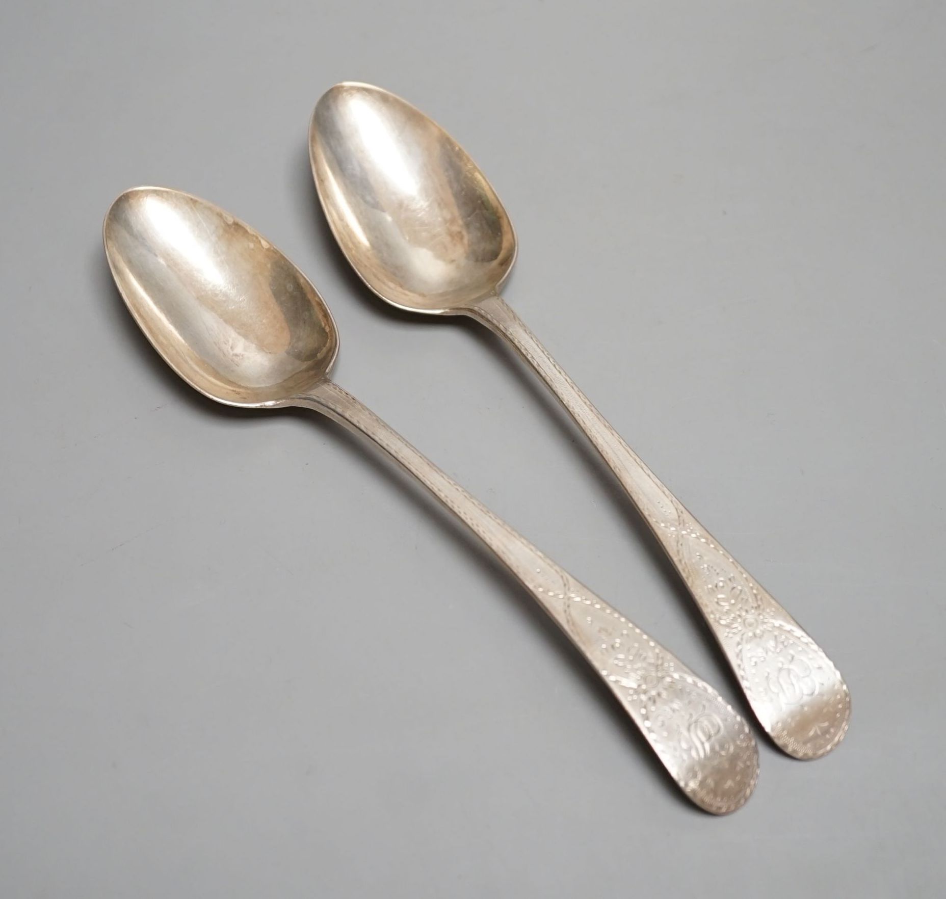 A pair of George III silver Old English spoons, with bright cut engraving, William Sumner, London, 1784